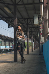 Fototapeta na wymiar Pretty girl posing in a metro station