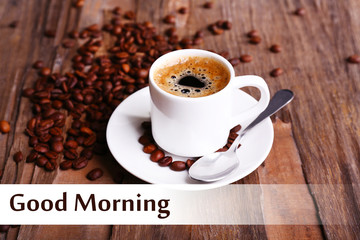 Cup of coffee and coffee beans on wooden background