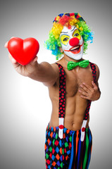 Clown with heart isolated on white
