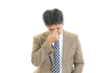 頭痛を訴えるビジネスマン