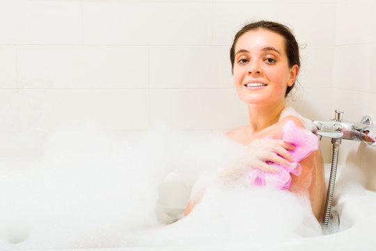 Girl with foam in bath