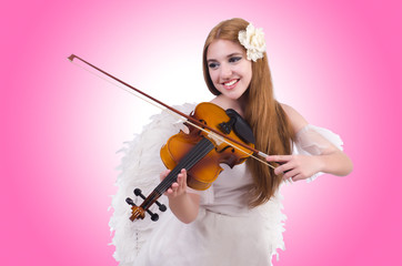 Young violin player isolated on white