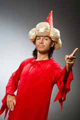 Funny wizard wearing red dress