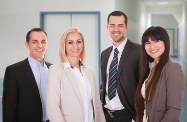 Confident Business Team Smiling In Office