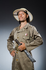 Funny safari hunter against background
