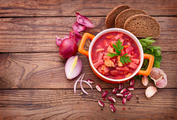 Ukrainian and Russian national Red Borscht on wooden table