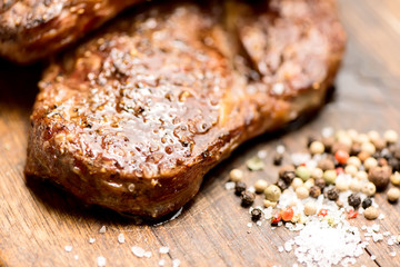 grilled steaks close up with salt and pepper