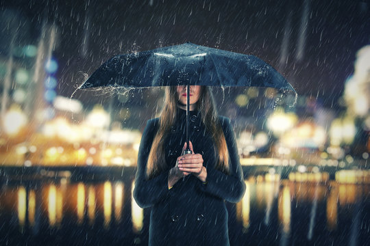 Woman Under Rain With Black Umbrella