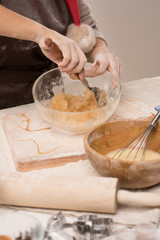 Unrecognizable woman preparing dough