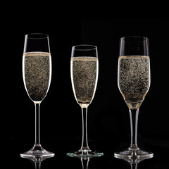 Champagne glasses on black background