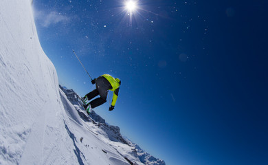 Naklejka na ściany i meble Skier in high mountains