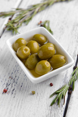 Marinated olives on table close-up