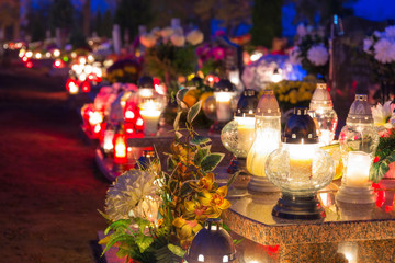 Colorful candles on the cemetery at All Saints Day, Poland