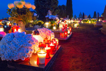 Colorful candles on the cemetery at All Saints Day, Poland
