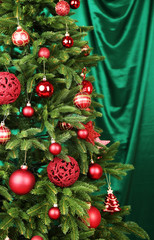 Decorated Christmas tree on fabric background