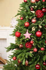 Decorated Christmas tree in room closeup