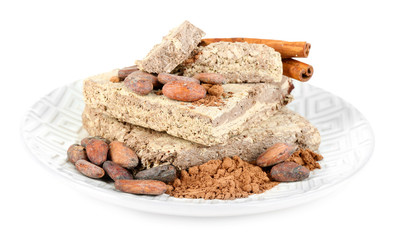 Sunflower halva with cocoa on plate isolated on white