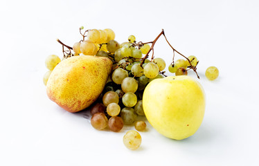 Pear, apple and branch of ripe grapes