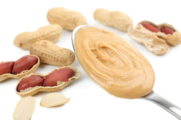Creamy peanut butter in spoon, close-up