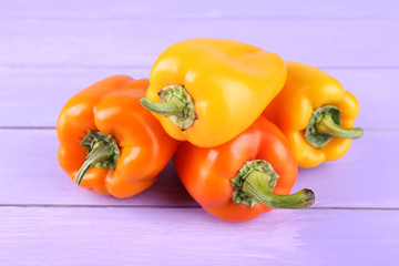 Pepper on wooden background
