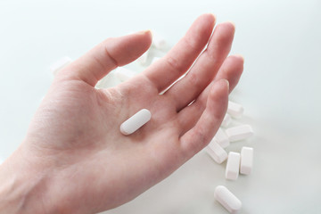 Pills in hand, close-up