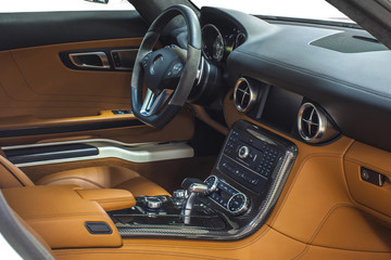 Interior of exclusive sport car. Orange cockpit