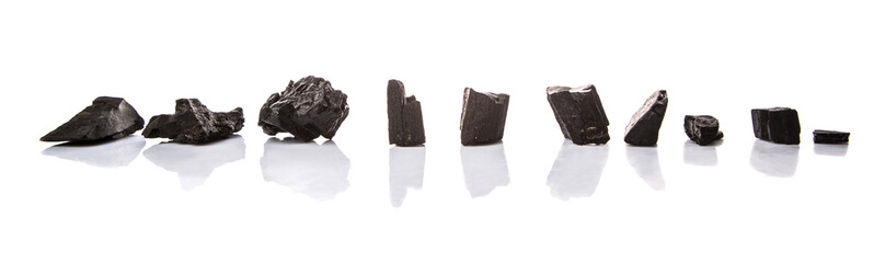 Lump of charcoal over white background