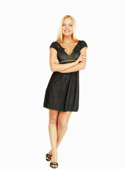 Fototapeta premium A young stylish girl standing with folded arms, isolated on