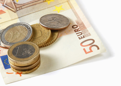 Money: euro coins and bills close up and glode