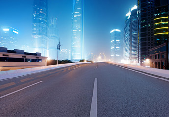 Asphalt road and modern city