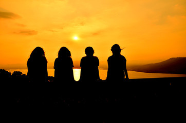 girl gang travel,silhouette sunset - 72483410