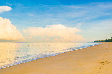 blue sea and cloudy blue sky over it.