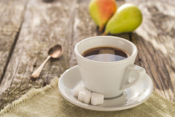 coffee cup black wooden board brown pears white