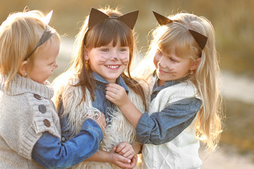Fototapeta premium Portrait of three girls in the woods girlfriends
