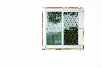 close up old window and white wall in house