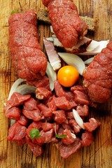 beef  roulade  with stuffing a wooden background