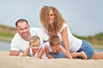 portrait of a happy family in summer nature