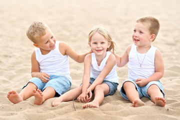 Fototapeta premium Portrait of children on the beach in summer
