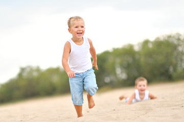 Portrait of children on the beach in summer