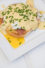Eggs Benedict toasted English muffins ham poached eggs and holla