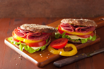 healthy sandwich with salami tomato pepper and lettuce