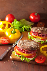 healthy sandwich with salami tomato pepper and lettuce
