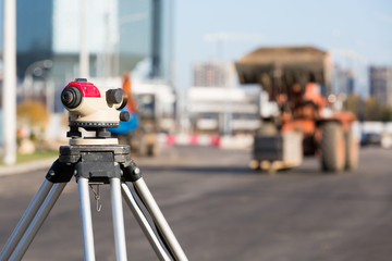 Land surveying equipment theodolite at construction site