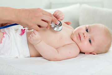 pediatrician inspection of little baby