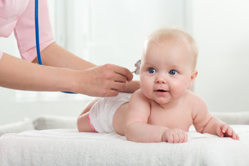pediatrician inspection of little baby