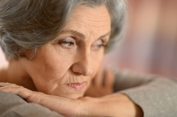 thinking elderly woman