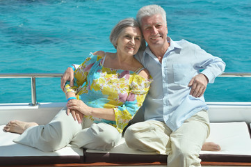 Elderly couple have a ride in a boat