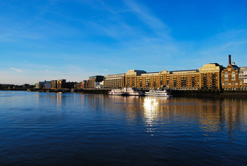 Butler's Wharf across a Calm River Thames