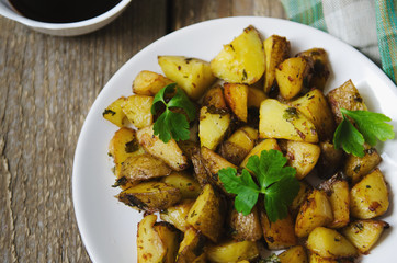 baked potatoes with sauce on a white plate