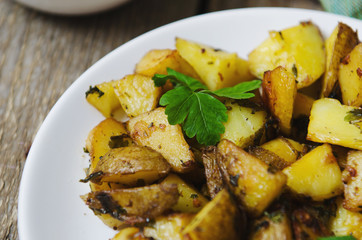baked potatoes with sauce on a white plate